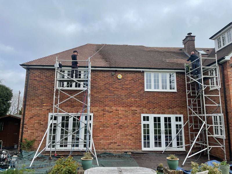 Roof cleaning carried out safely from scaffold towers by The Roof Moss Cleaners in Luton
